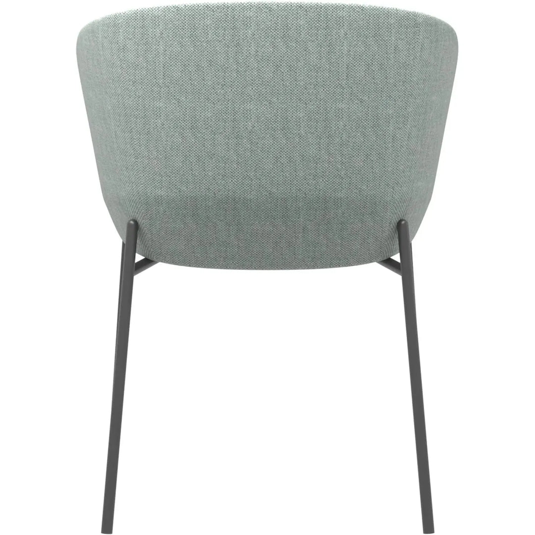 Industrial metal fabric dining chair slicing in still life.