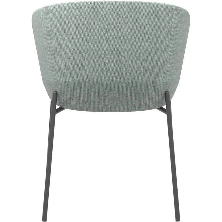 Industrial metal fabric dining chair slicing in still life.