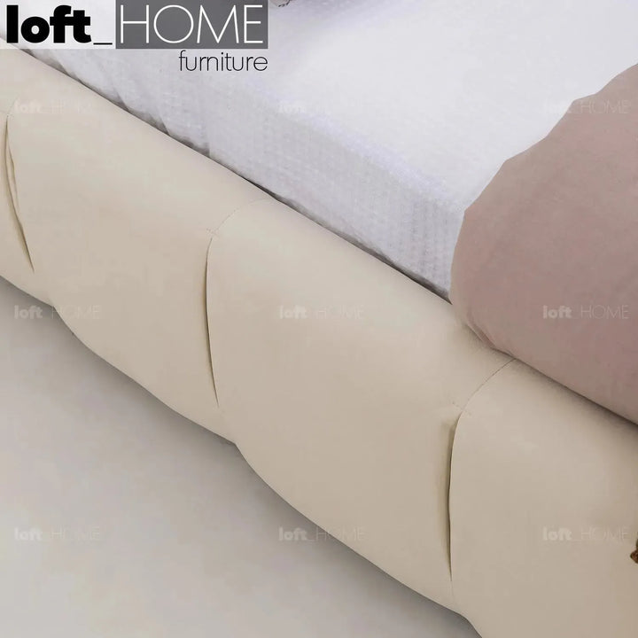 Contemporary suede fabric bed tufty in close up details.