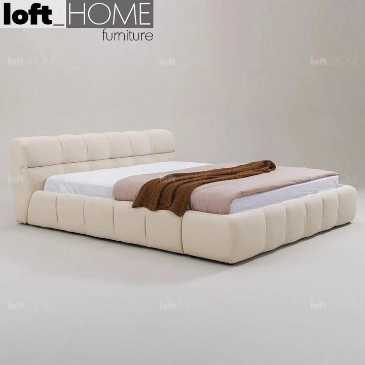 Contemporary suede fabric bed tufty in real life style.