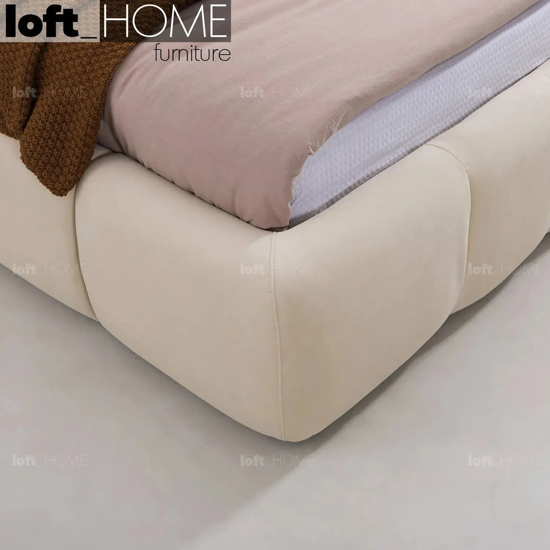 Contemporary suede fabric bed tufty in details.