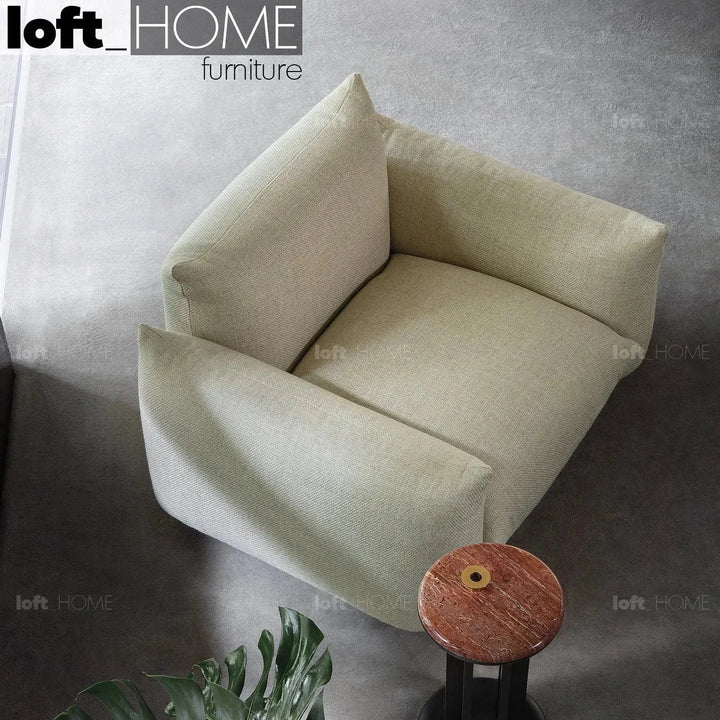 Cream teddy fabric 1 seater sofa marenco in still life.