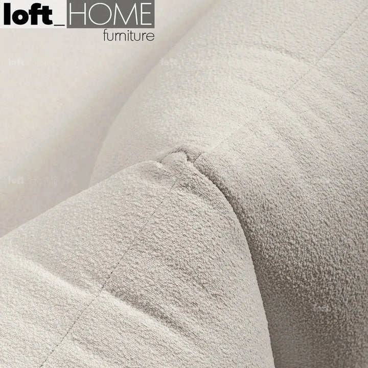 Cream teddy fabric 1 seater sofa marenco with context.