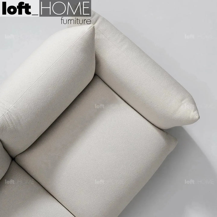 Cream teddy fabric 1 seater sofa marenco in details.