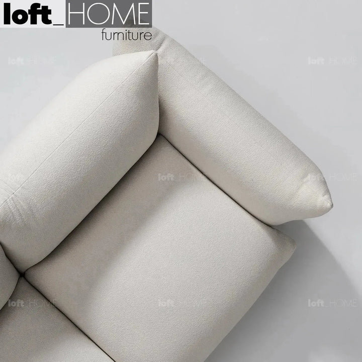Cream teddy fabric 2 seater sofa marenco in details.