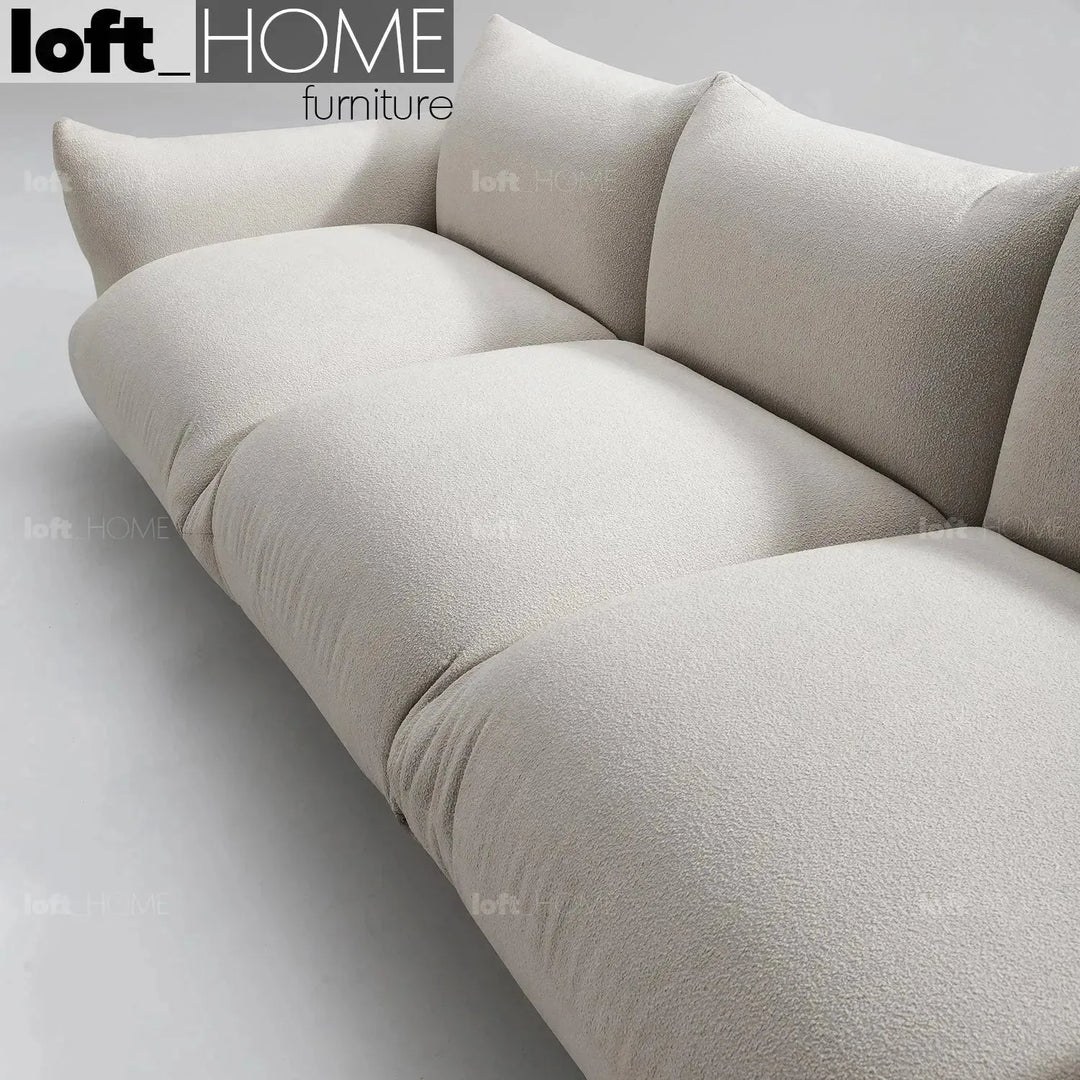 Cream teddy fabric 3 seater sofa marenco in close up details.