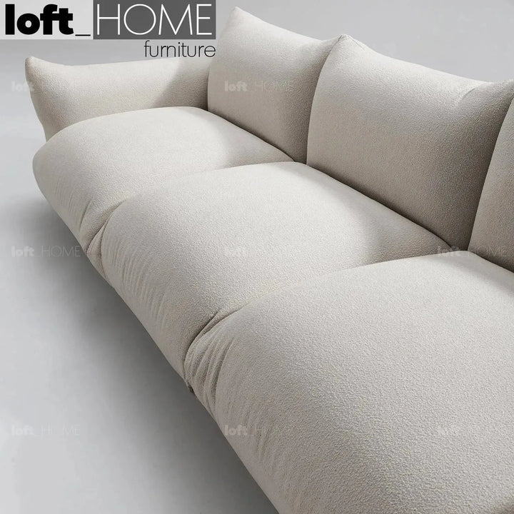Cream teddy fabric 3 seater sofa marenco in close up details.