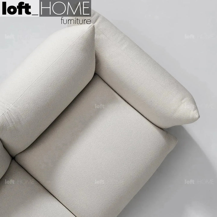Cream teddy fabric 3 seater sofa marenco in details.