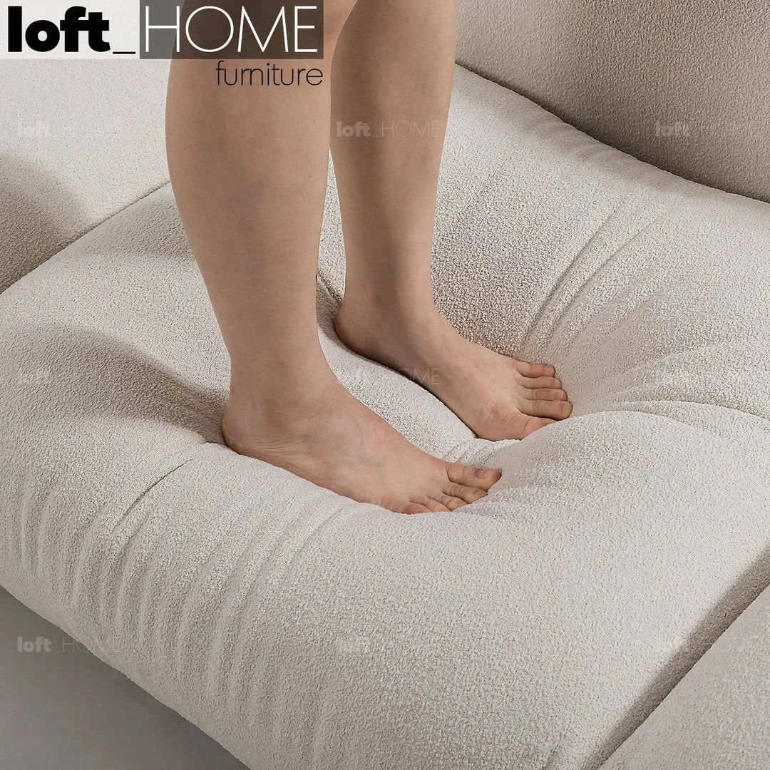 Cream teddy fabric 4 seater sofa marenco in details.