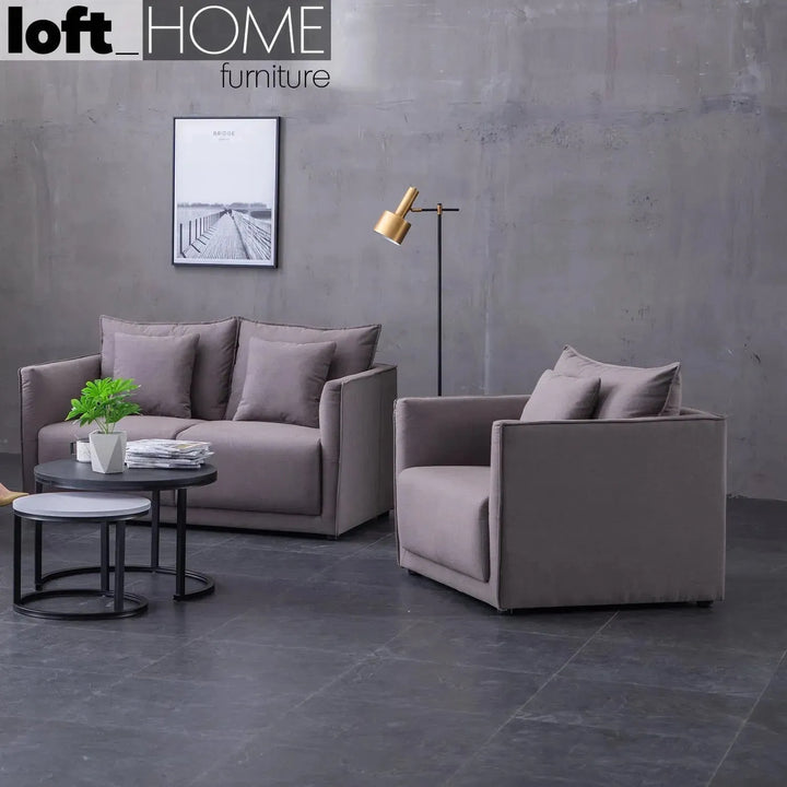 Modern fabric 1 seater sofa adam in still life.