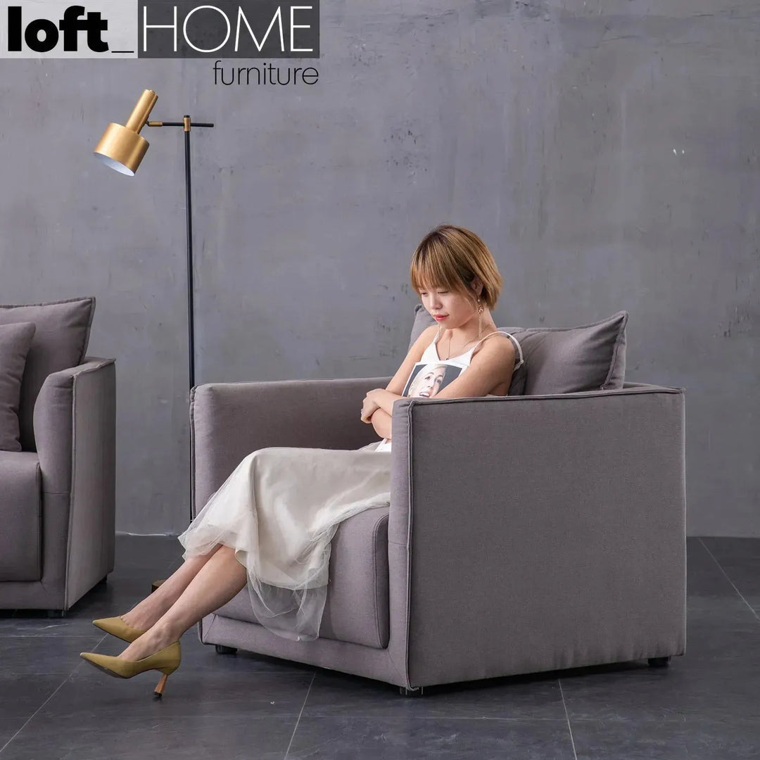 Modern fabric 1 seater sofa adam with context.