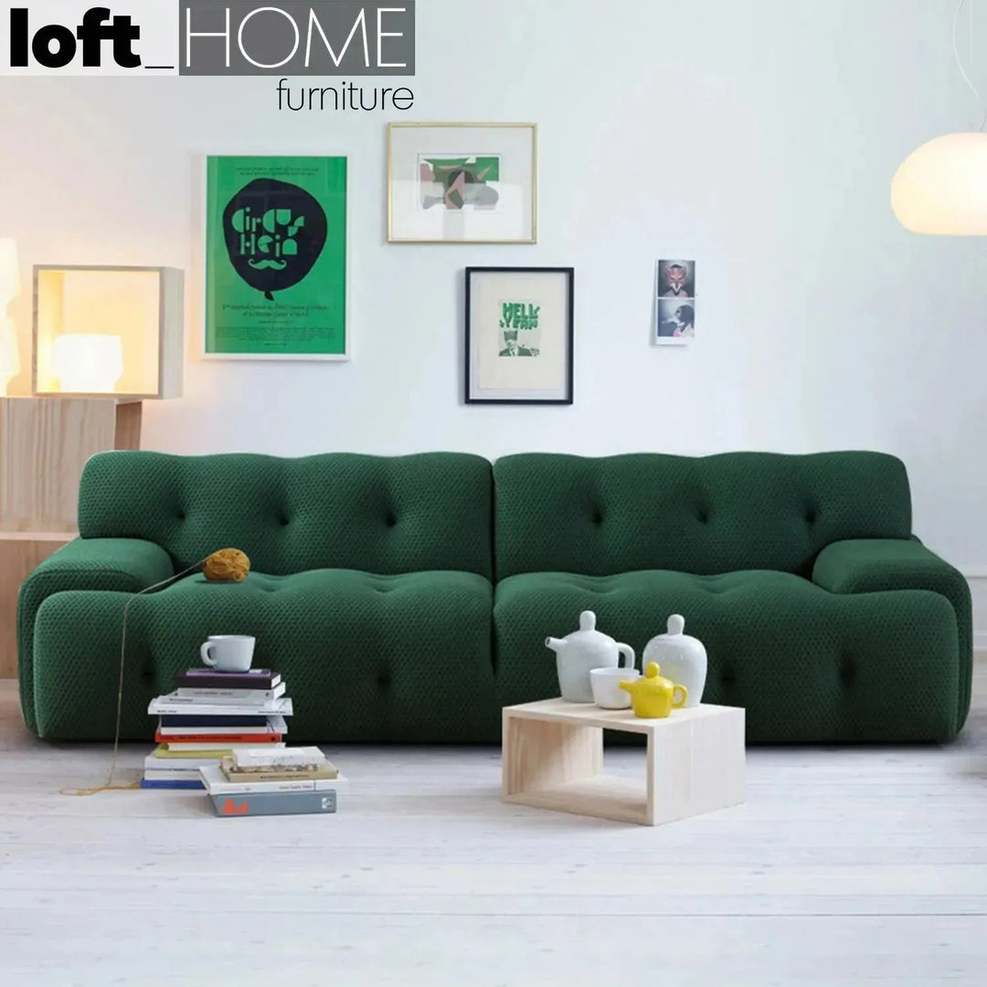 Contemporary fabric 3 seater sofa blogger in close up details.