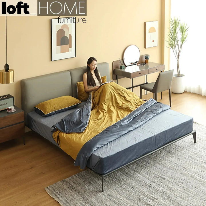 Minimalist genuine leather bed armelle in close up details.