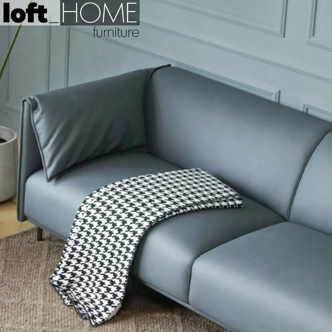 Modern microfiber leather 3 seater sofa beam in close up details.