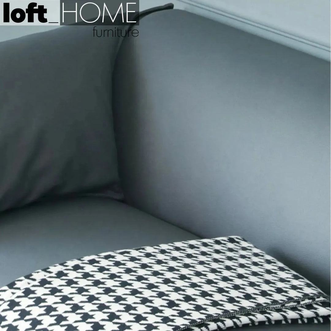 Modern microfiber leather 3 seater sofa beam in still life.