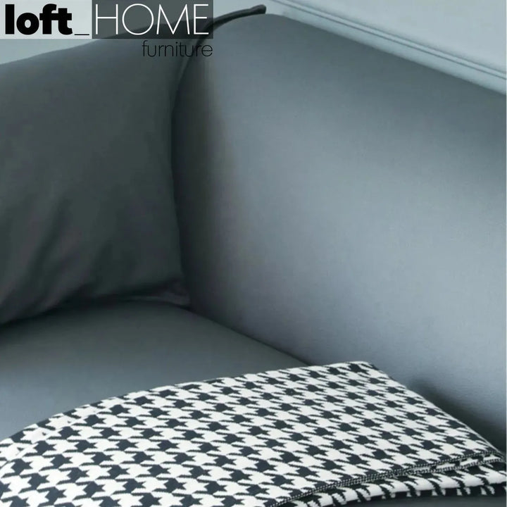 Modern microfiber leather 3 seater sofa beam in still life.