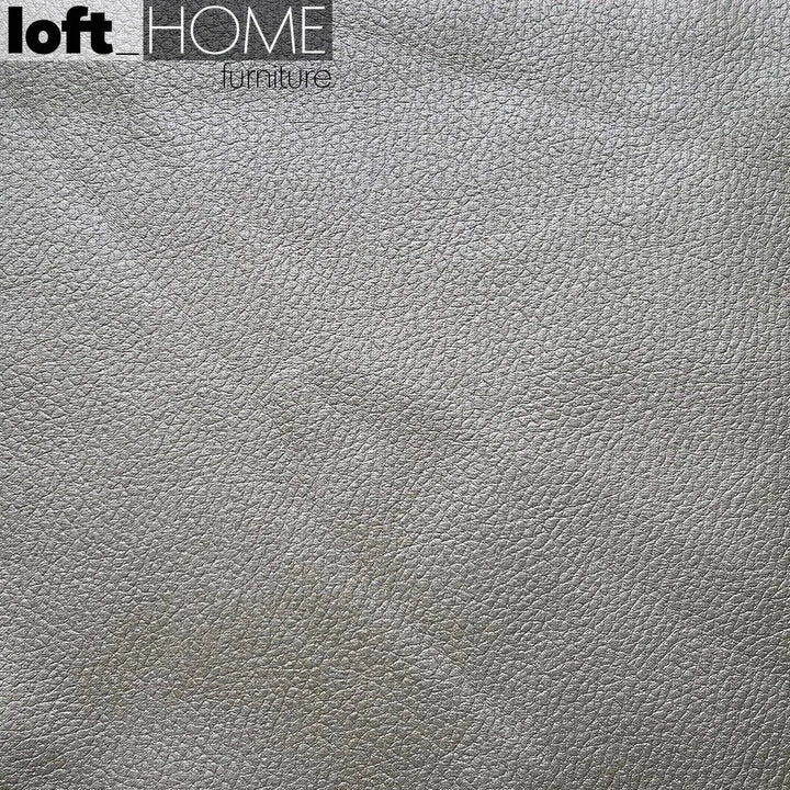 Modern microfiber leather 4 seater sofa beam in still life.