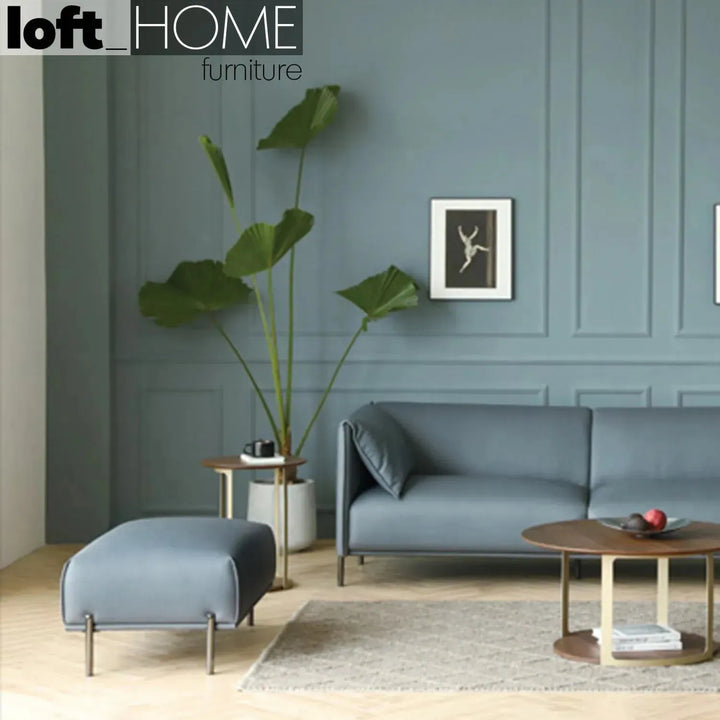 Modern microfiber leather ottoman beam in close up details.