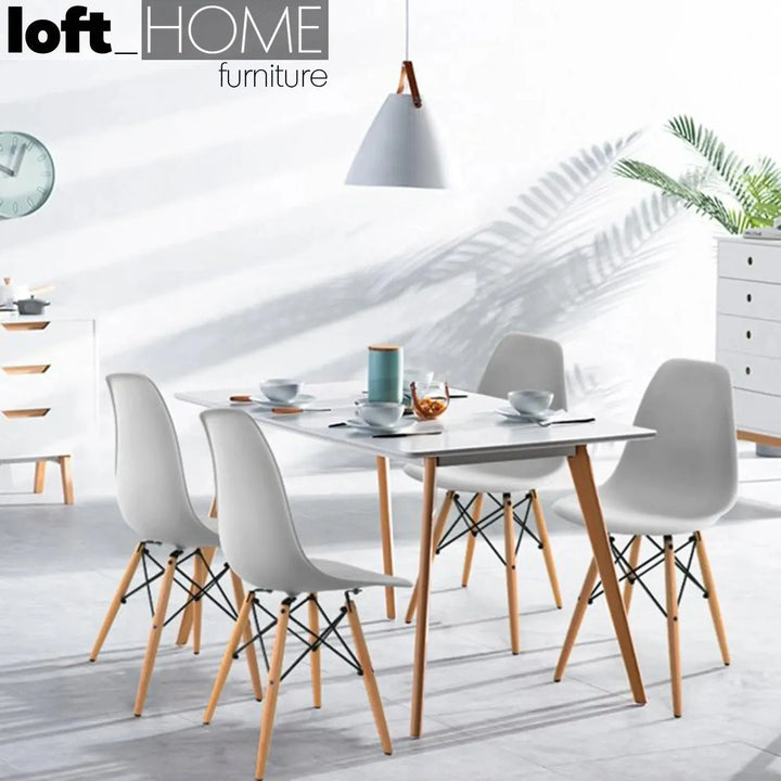 Contemporary plastic dining chair eames grey in real life style.