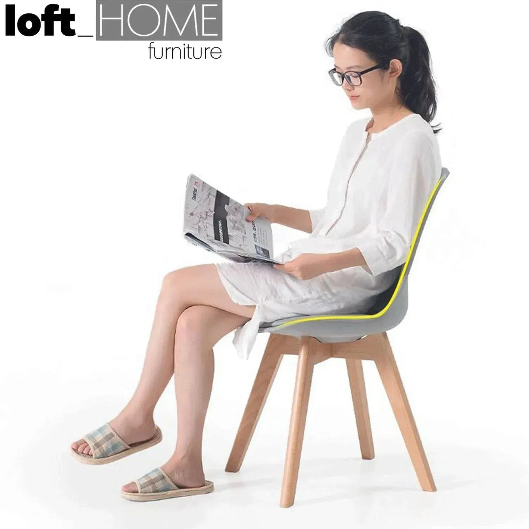 Contemporary plastic dining chair linnet grey in close up details.