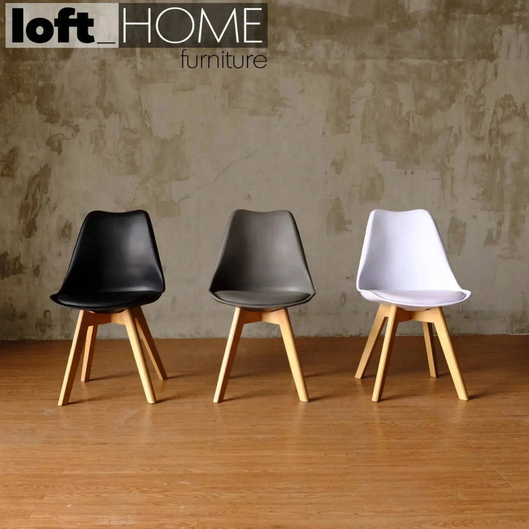 Contemporary plastic dining chair linnet grey in real life style.