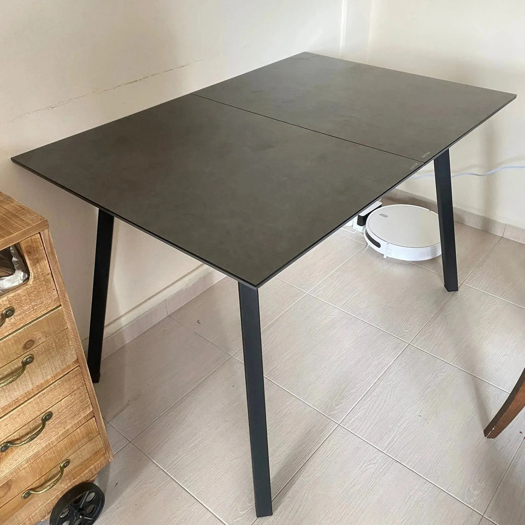 Modern tempered glass extendable dining table glaze in real life style.