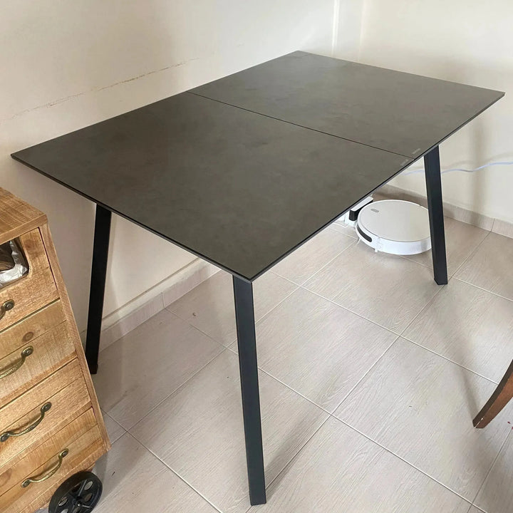 Modern tempered glass extendable dining table glaze in real life style.