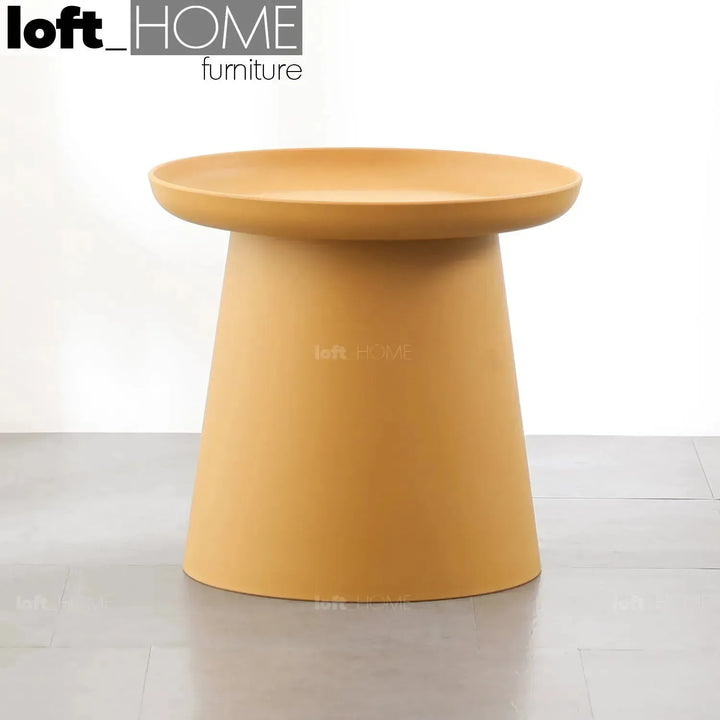 Contemporary plastic side table macaron with context.