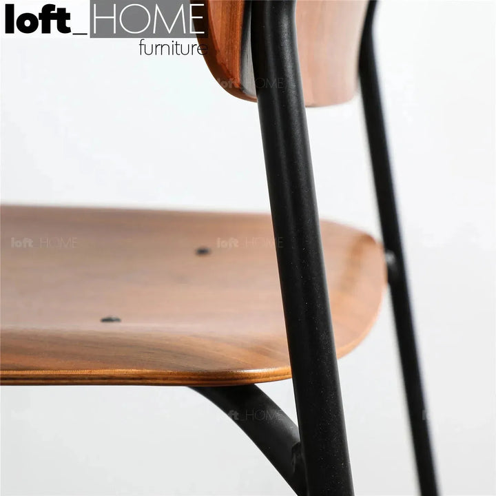 Industrial wood dining chair tambo with context.