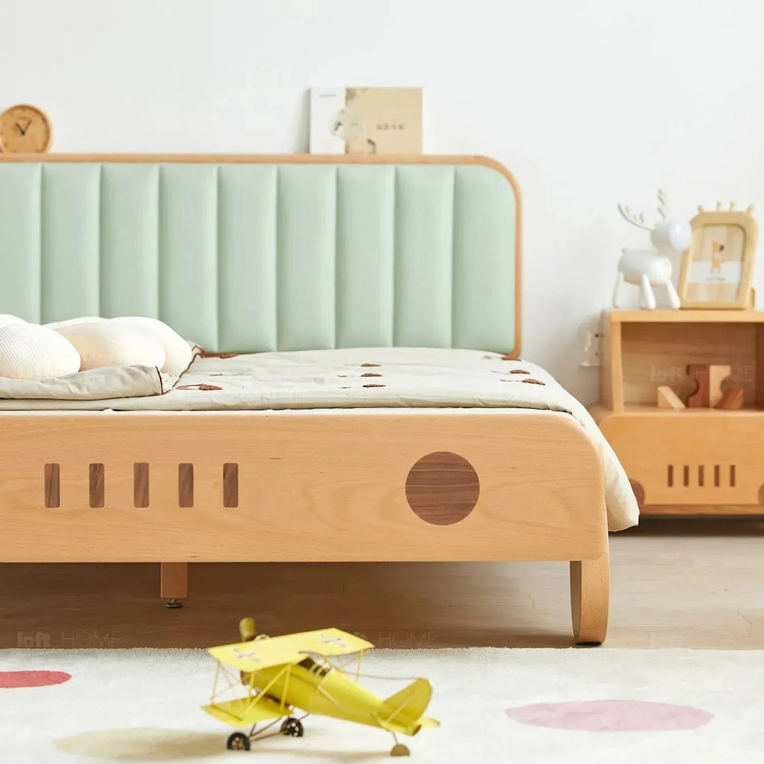 Scandinavian wood kids bed car with context.