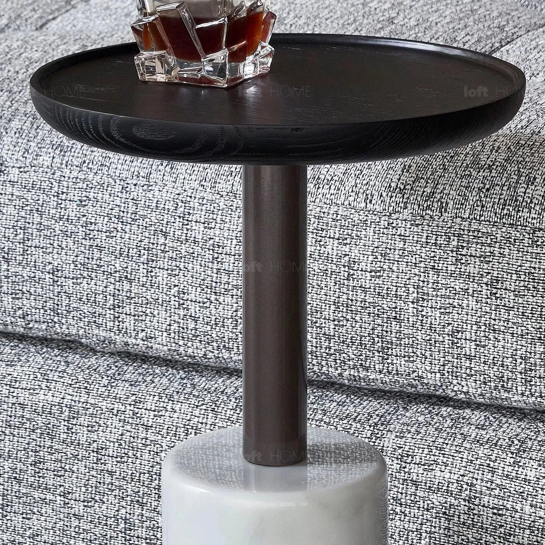 Japandi wood side table lumen in close up details.