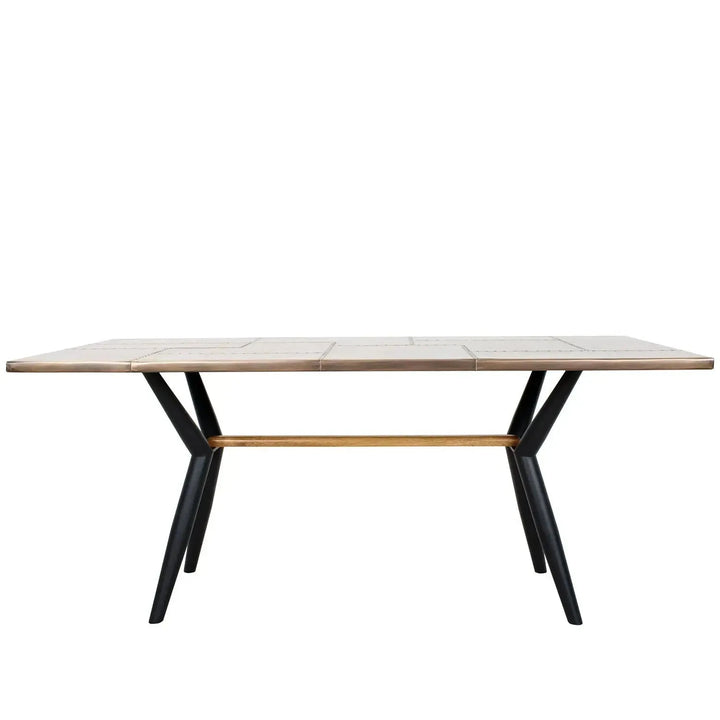 Industrial brass dining table lucien brass in white background.