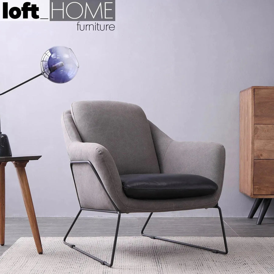 Industrial canvas and genuine leather 1 seater sofa cale primary product view.