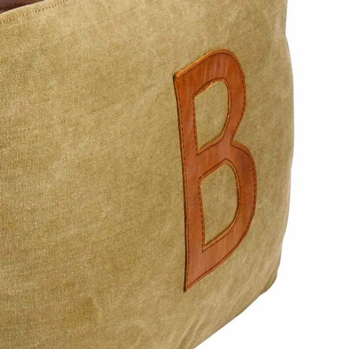 Vintage canvas ottoman alphabet in still life.