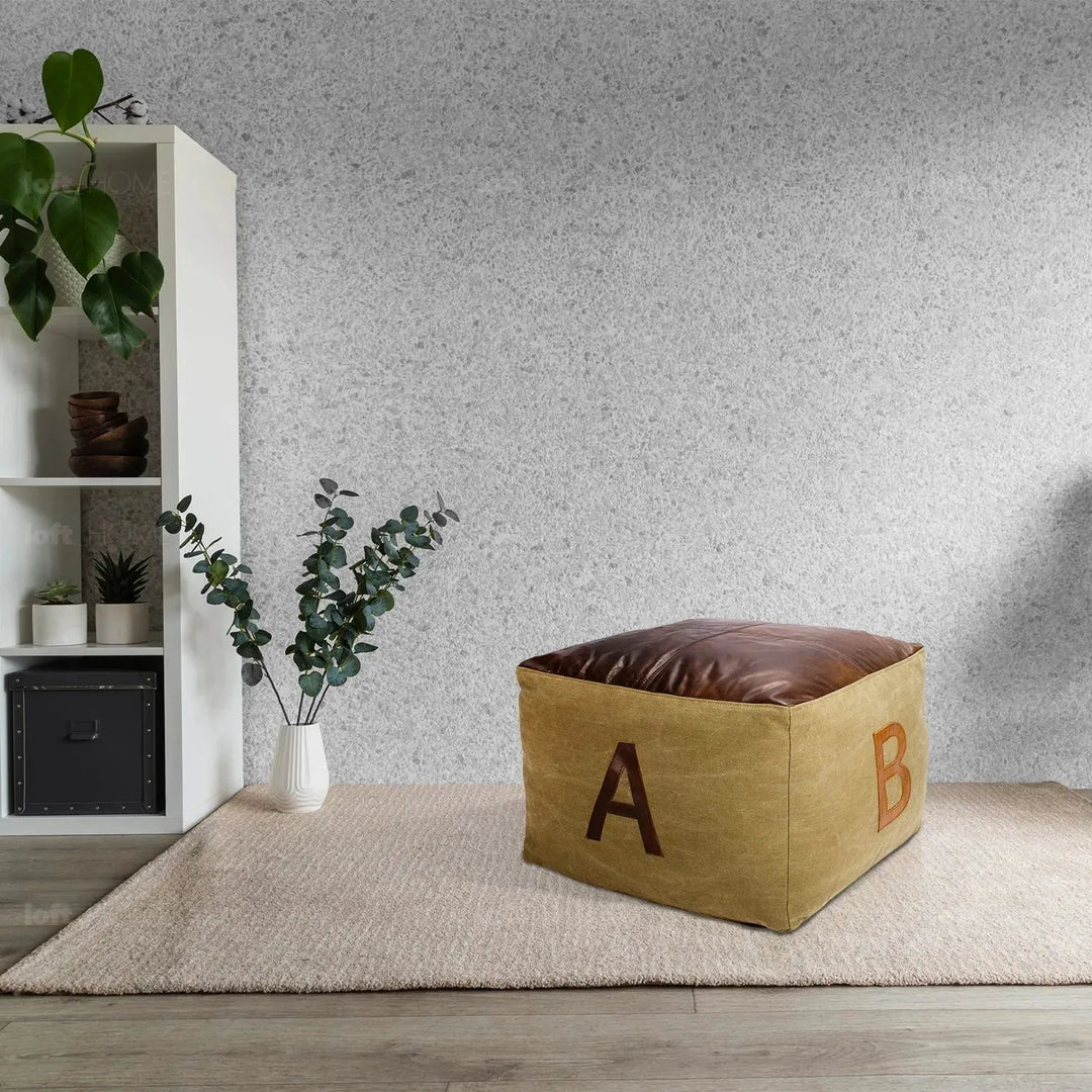 Vintage canvas ottoman alphabet with context.