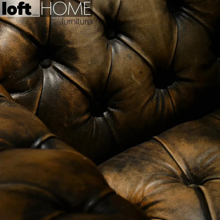 Vintage genuine leather 1 seater sofa chesterfield button in real life style.