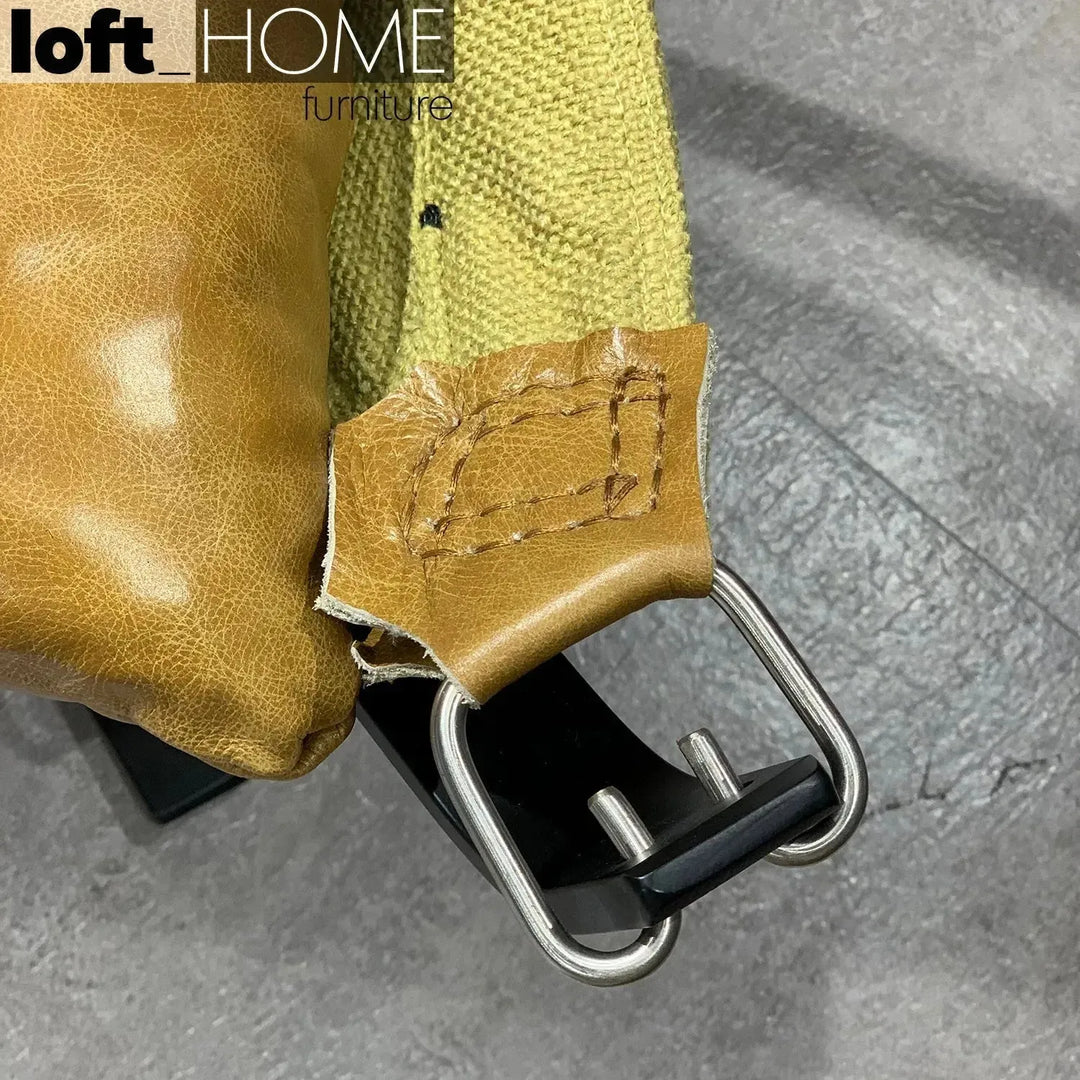 Industrial genuine leather 1 seater sofa hopper in close up details.