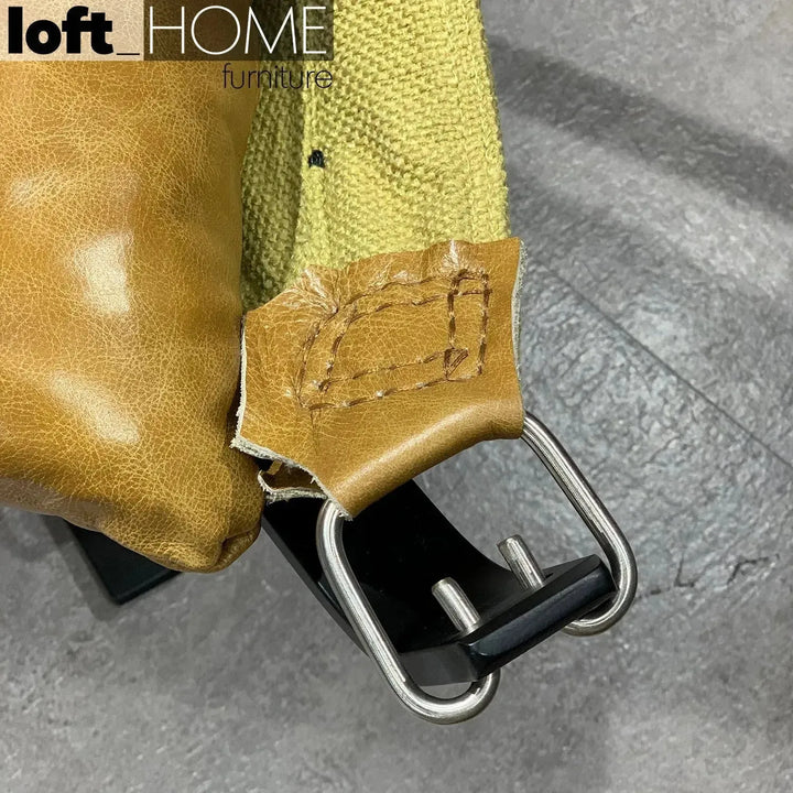 Industrial genuine leather 1 seater sofa hopper in close up details.