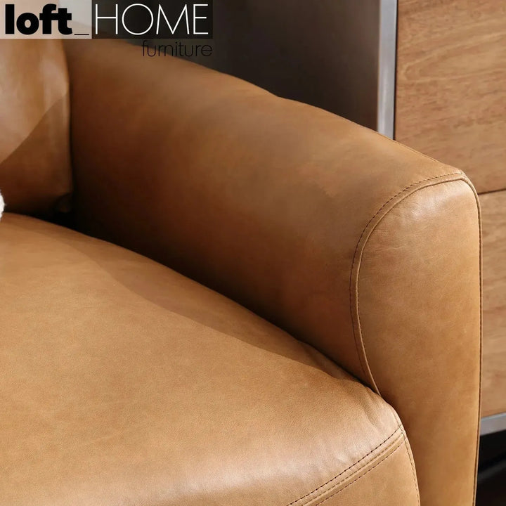 Vintage genuine leather 1 seater sofa rw and nut ter with context.