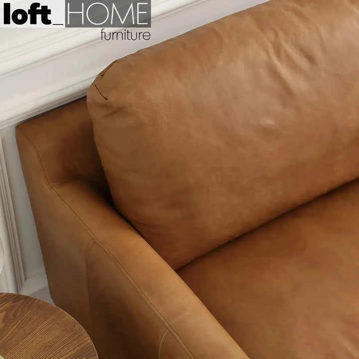 Vintage genuine leather 1 seater sofa rw and nut ter in details.