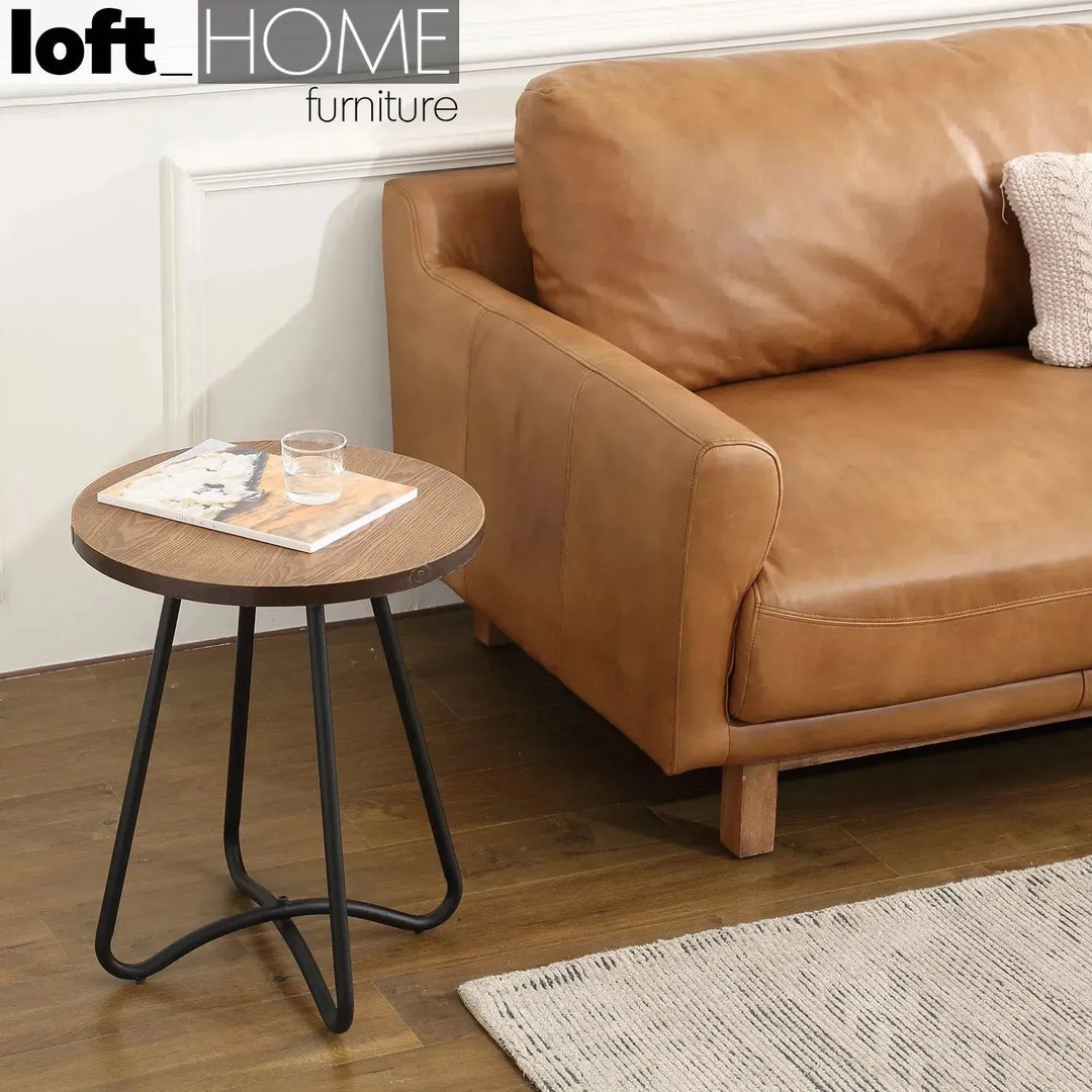 Vintage genuine leather 1 seater sofa rw and nut ter in close up details.