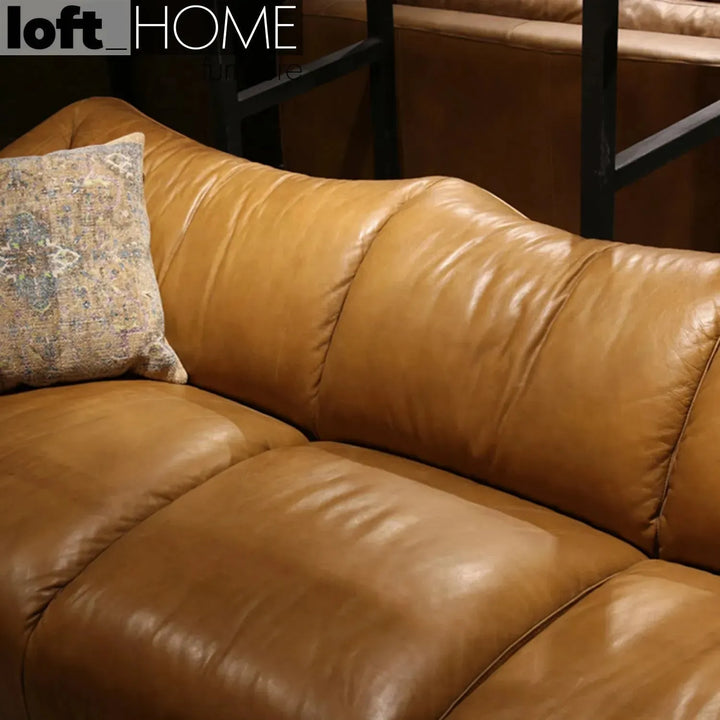 Vintage genuine leather 2 seater sofa beanbag with context.