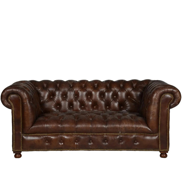 Vintage genuine leather 2 seater sofa chesterfield button in white background.
