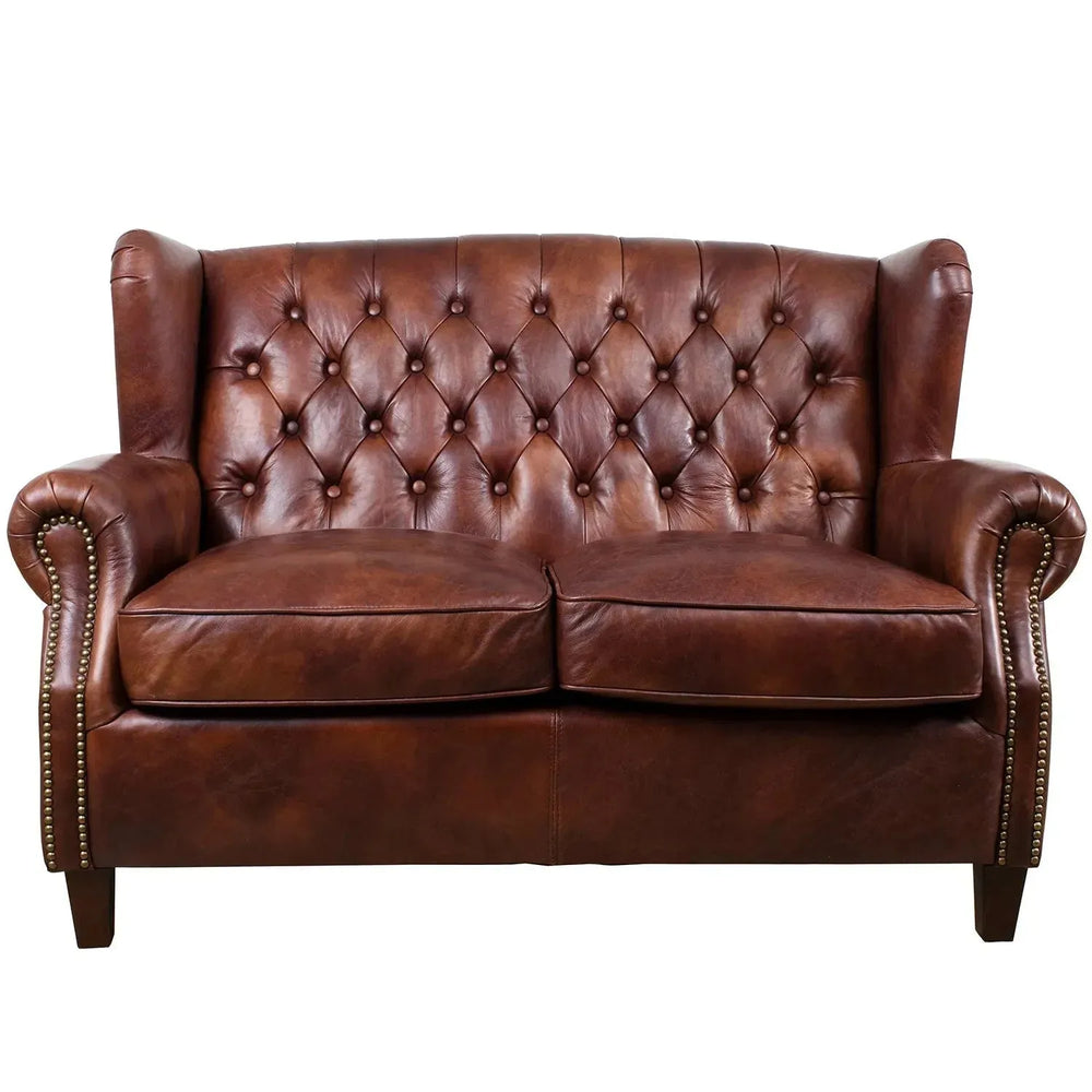 Vintage genuine leather 2 seater sofa franco in white background.