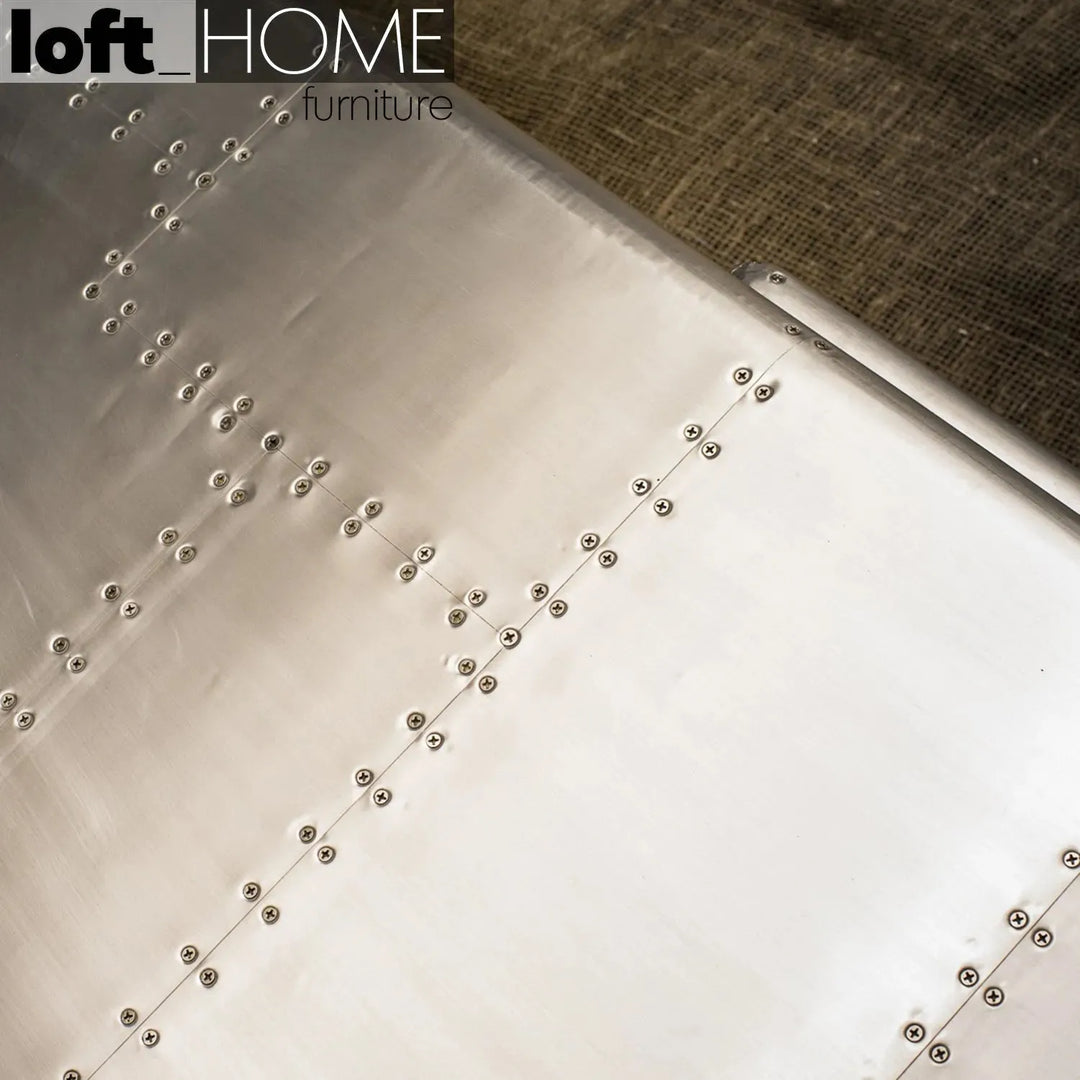Industrial genuine leather 2 seater sofa silver aircraft in still life.