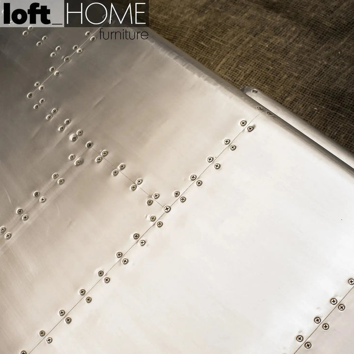 Industrial genuine leather 2 seater sofa silver aircraft in still life.