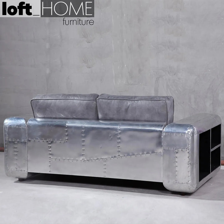 Industrial genuine leather 2 seater sofa silver aircraft in close up details.
