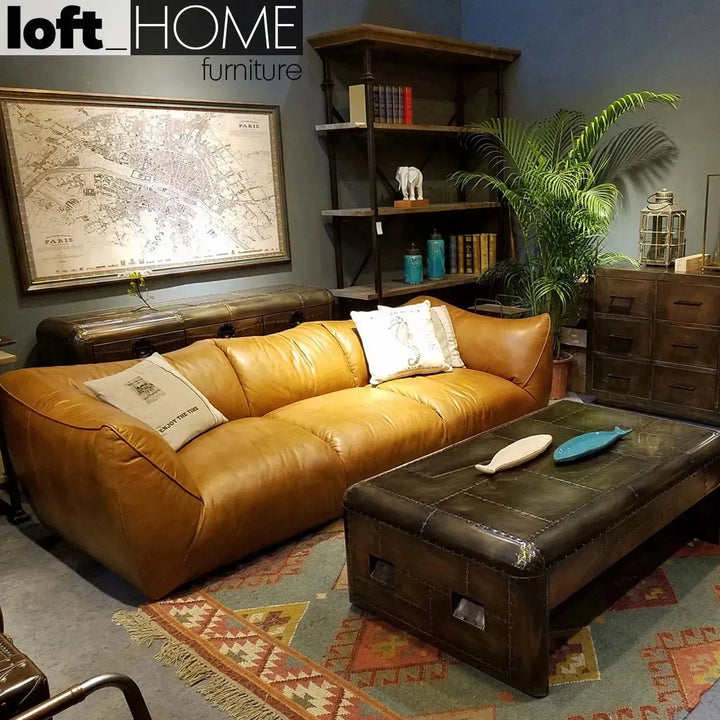 Vintage genuine leather 3 seater sofa beanbag in panoramic view.