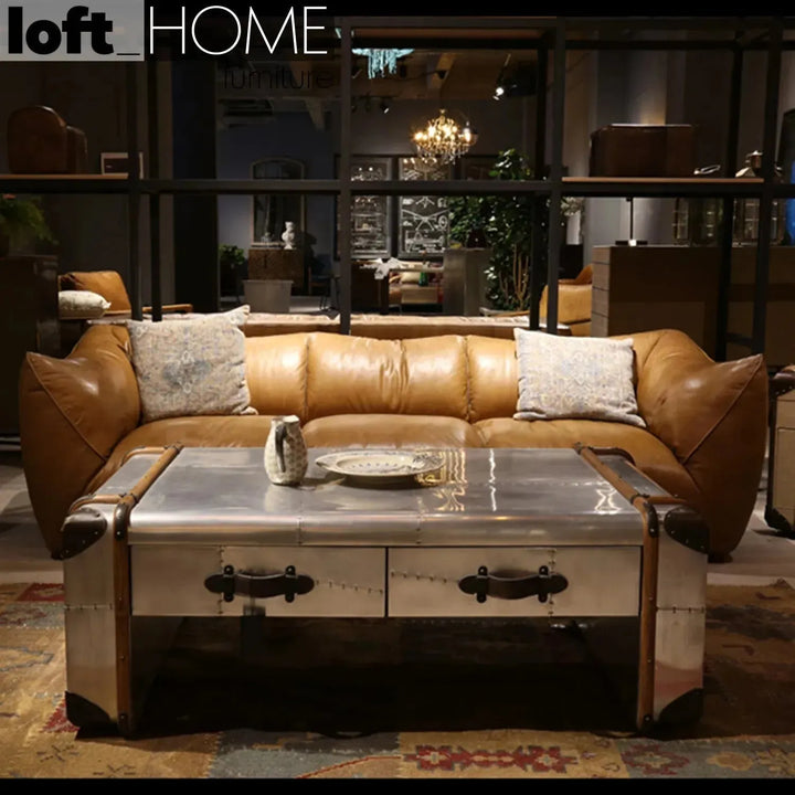 Vintage genuine leather 3 seater sofa beanbag with context.