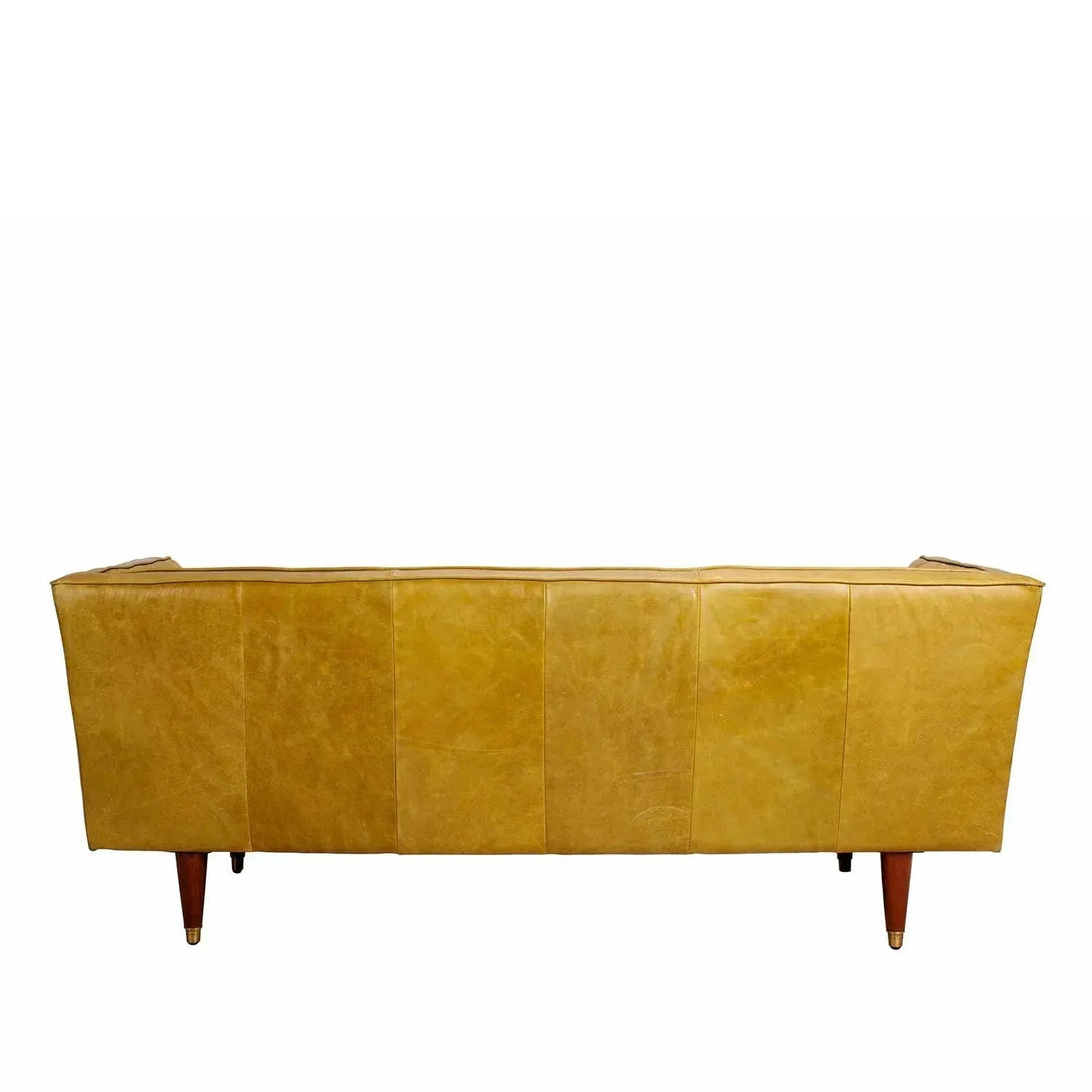 Vintage genuine leather 3 seater sofa lush in details.